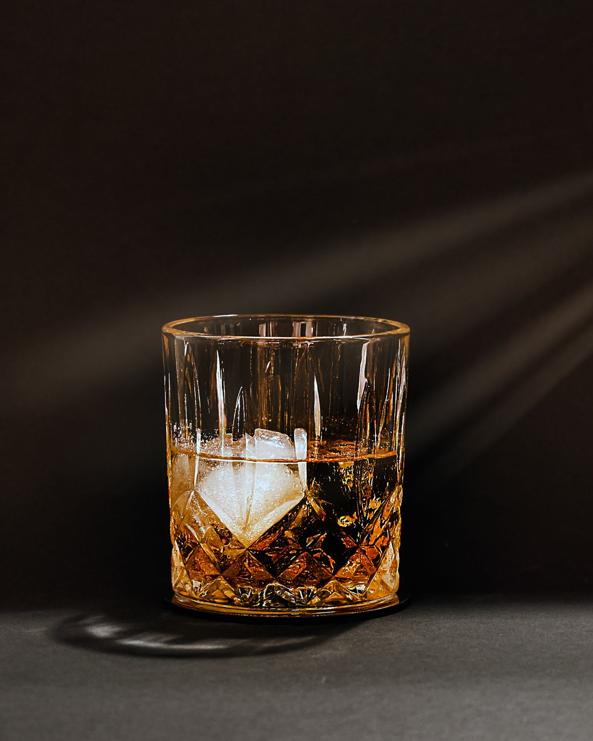 Whiskey and ice in a cut crystal glass